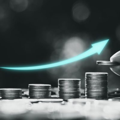 The coins are stacked together with the morning sun shining.